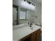 The bathroom includes a large mirror, wood cabinet and bathtub at 2042 N Parish N Ln, Casa Grande, AZ 85122