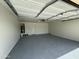 Spacious two-car garage featuring epoxy floor, water heater, and ample storage space at 2042 N Parish N Ln, Casa Grande, AZ 85122