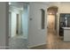 Hallway leading to the kitchen and bedrooms, creating a smooth flow within the home at 2042 N Parish N Ln, Casa Grande, AZ 85122