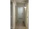 Hallway with multiple access points, showcasing the layout and connectivity of the house at 2042 N Parish N Ln, Casa Grande, AZ 85122