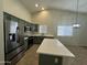 Kitchen with stainless steel appliances, island, and stylish cabinetry, offering a modern look at 2042 N Parish N Ln, Casa Grande, AZ 85122