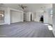 Open floor plan features neutral carpet, a ceiling fan, and access to the kitchen at 21334 E Lords Ct, Queen Creek, AZ 85142