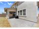 Paver patio and covered porch area with grill at 21716 S 225Th Way, Queen Creek, AZ 85142