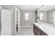 Bathroom with double vanity, tile floor, view into water closet, and glass enclosed shower at 21716 S 225Th Way, Queen Creek, AZ 85142