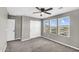 Bedroom featuring neutral paint, closet, and natural light from three windows at 21716 S 225Th Way, Queen Creek, AZ 85142