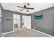 Cozy bedroom featuring a ceiling fan, carpet, and closet access at 21716 S 225Th Way, Queen Creek, AZ 85142