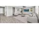 Spacious living room with hardwood floors, recessed lighting, and neutral decor at 21716 S 225Th Way, Queen Creek, AZ 85142