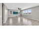 Bright living room featuring wood-look floors, neutral walls and windows with natural light at 21716 S 225Th Way, Queen Creek, AZ 85142