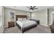 Bedroom suite with dark wood furniture, a large bed and abundant natural light at 21716 S 225Th Way, Queen Creek, AZ 85142