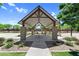 Outdoor picnic area features covered seating, brick pillars and manicured landscaping in a common area at 21716 S 225Th Way, Queen Creek, AZ 85142