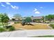 Community playground featuring a covered wagon play structure at 21716 S 225Th Way, Queen Creek, AZ 85142