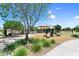 Community playground includes slides, climbing structure and is surrounded by a landscaped common area at 21716 S 225Th Way, Queen Creek, AZ 85142