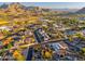 An aerial view captures a charming neighborhood in Scottsdale with mountain views and convenient access to a freeway at 2712 E Mountain View Rd, Phoenix, AZ 85028