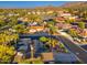 Aerial view of a neighborhood featuring desert landscaping and solar panels at 2712 E Mountain View Rd, Phoenix, AZ 85028