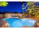 Expansive backyard featuring a sparkling pool, comfortable seating, desert landscaping, providing an ideal space for outdoor enjoyment at 2712 E Mountain View Rd, Phoenix, AZ 85028