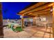 Relaxing backyard featuring a pool, spa, wood-burning fireplace, and covered patio with a custom bar at 2712 E Mountain View Rd, Phoenix, AZ 85028