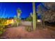Southwestern home featuring desert landscaping, mature trees, and a private front courtyard at 2712 E Mountain View Rd, Phoenix, AZ 85028