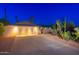 Home with a large driveway, desert landscaping, and a two-car garage at 2712 E Mountain View Rd, Phoenix, AZ 85028