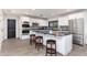 Bright kitchen with white cabinets, granite countertops, stainless steel appliances, and center island with seating at 2712 E Mountain View Rd, Phoenix, AZ 85028