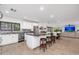 Spacious kitchen with center island, stainless steel fridge, and open layout to dining and living area at 2712 E Mountain View Rd, Phoenix, AZ 85028