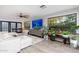 Well-lit living area with large windows, a comfortable sectional, and stylish decor at 2712 E Mountain View Rd, Phoenix, AZ 85028