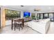 Bright living room with modern furnishings, large windows, and tile flooring create a welcoming space at 2712 E Mountain View Rd, Phoenix, AZ 85028