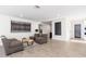 Comfortable living room featuring neutral tones and contemporary decor, tile flooring, and recessed lighting at 2712 E Mountain View Rd, Phoenix, AZ 85028