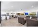 Expansive open floor plan with living and dining areas, plus kitchen with stainless appliances and tile flooring at 2712 E Mountain View Rd, Phoenix, AZ 85028
