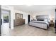Comfortable main bedroom featuring tile flooring, dresser, and neutral decor create a relaxing retreat at 2712 E Mountain View Rd, Phoenix, AZ 85028