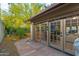 Outdoor patio area with large sliding doors, seamlessly blending indoor and outdoor living, perfect for entertaining at 2712 E Mountain View Rd, Phoenix, AZ 85028