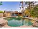 Stunning pool area with lush landscaping and outdoor seating, ideal for relaxation and entertaining in a private setting at 2712 E Mountain View Rd, Phoenix, AZ 85028