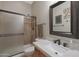 Updated bathroom featuring a granite countertop and a shower with a sliding glass door at 2784 E Honeysuckle Pl, Chandler, AZ 85286
