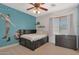 Fun bedroom featuring cheerful decor, a comfortable bed, and themed accents for a playful atmosphere at 2784 E Honeysuckle Pl, Chandler, AZ 85286