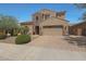 Charming two-story home featuring a stone accent wall and a spacious two-car garage at 2784 E Honeysuckle Pl, Chandler, AZ 85286