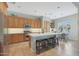 Spacious kitchen featuring wooden cabinets, stainless steel appliances, a center island, and a breakfast nook at 2784 E Honeysuckle Pl, Chandler, AZ 85286