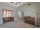 Inviting living room features a piano, custom window shutters, and ample space at 2784 E Honeysuckle Pl, Chandler, AZ 85286