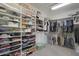 Walk-in closet featuring custom shelves and plenty of storage for all your personal items at 2784 E Honeysuckle Pl, Chandler, AZ 85286