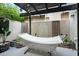 Tranquil backyard haven with a white hammock, lush greenery, and shaded pergola for ultimate relaxation at 2839 N 61St St, Scottsdale, AZ 85257