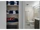 Linen closet featuring large selection of towels and an adjacent partial view of the bathroom at 2839 N 61St St, Scottsdale, AZ 85257