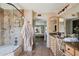 Bathroom features tiled shower, vanity seating, granite counters, and access to the primary bedroom at 2839 N 61St St, Scottsdale, AZ 85257