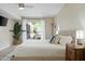 King-sized bed in a bright bedroom with sliding glass doors to the outdoor patio at 2839 N 61St St, Scottsdale, AZ 85257