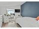 Bedroom featuring a white desk area with drawers and an adjacent work station with a mounted television at 2839 N 61St St, Scottsdale, AZ 85257