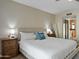 Bright bedroom features a king bed, wood nightstands and sliding glass door at 2839 N 61St St, Scottsdale, AZ 85257