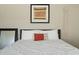 Comfortable bedroom features neutral decor, a decorative piece above the bed, and a macrame wall hanging at 2839 N 61St St, Scottsdale, AZ 85257