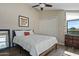 Well-lit bedroom features wood-look floors, ceiling fan and double-door closet for optimal storage at 2839 N 61St St, Scottsdale, AZ 85257