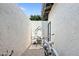 Enclosed courtyard with brick paving featuring an outdoor seating area and charming bicycle at 2839 N 61St St, Scottsdale, AZ 85257