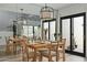 Bright dining room featuring a natural wood table, seating for six, and modern pendant lighting at 2839 N 61St St, Scottsdale, AZ 85257