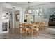 Bright dining room with wood table and mirrored wall overlooking the kitchen at 2839 N 61St St, Scottsdale, AZ 85257