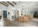 Dining room with wood table, mirrored wall, and view into the kitchen at 2839 N 61St St, Scottsdale, AZ 85257