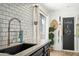 Stylish kitchen with modern fixtures, subway tile backsplash, and dark cabinetry, creating a contemporary and functional space at 2839 N 61St St, Scottsdale, AZ 85257